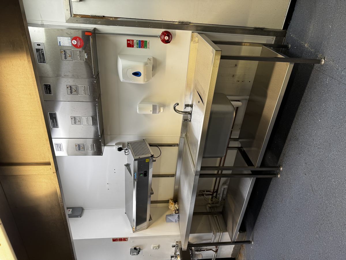 Atrium Kitchen — prep and wash area with stainless sink bench, Polar refrigerated unit and Ansul fire suppression