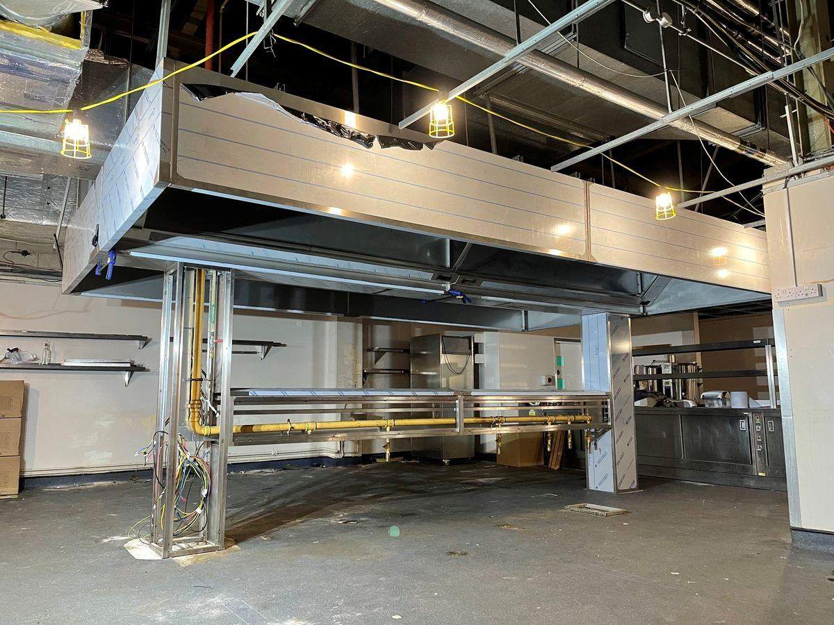 CCE engineers installing the MUB630 box fan and ductwork connections — EMCC Nottingham