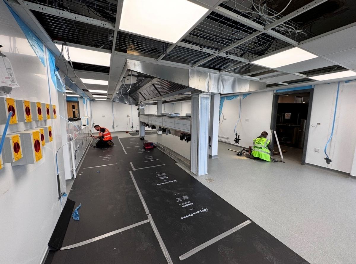 CCE engineers working on Games Workshop kitchen installation — electrics and services phase