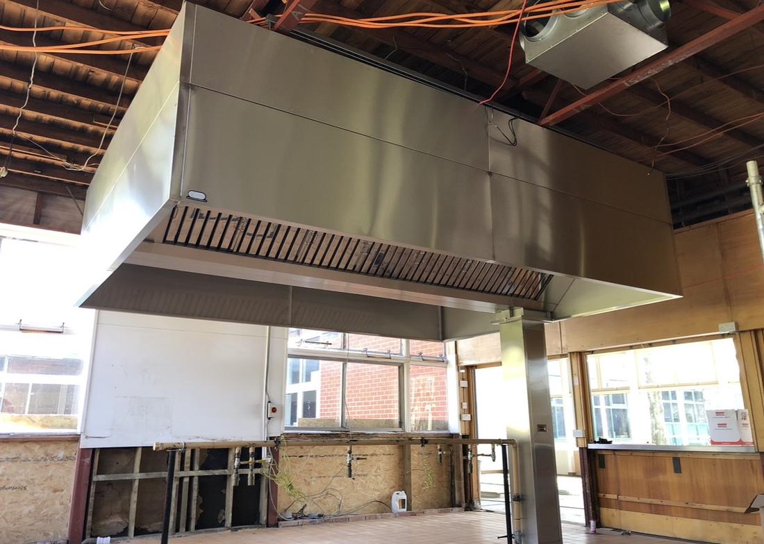 New CCE bespoke stainless steel island extraction canopy installed in a new build kitchen