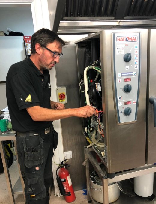 CCE engineer repairing a Rational combi oven control panel — reactive maintenance Nottingham