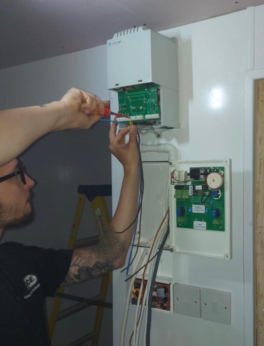 CCE engineer wiring a gas interlocking control panel