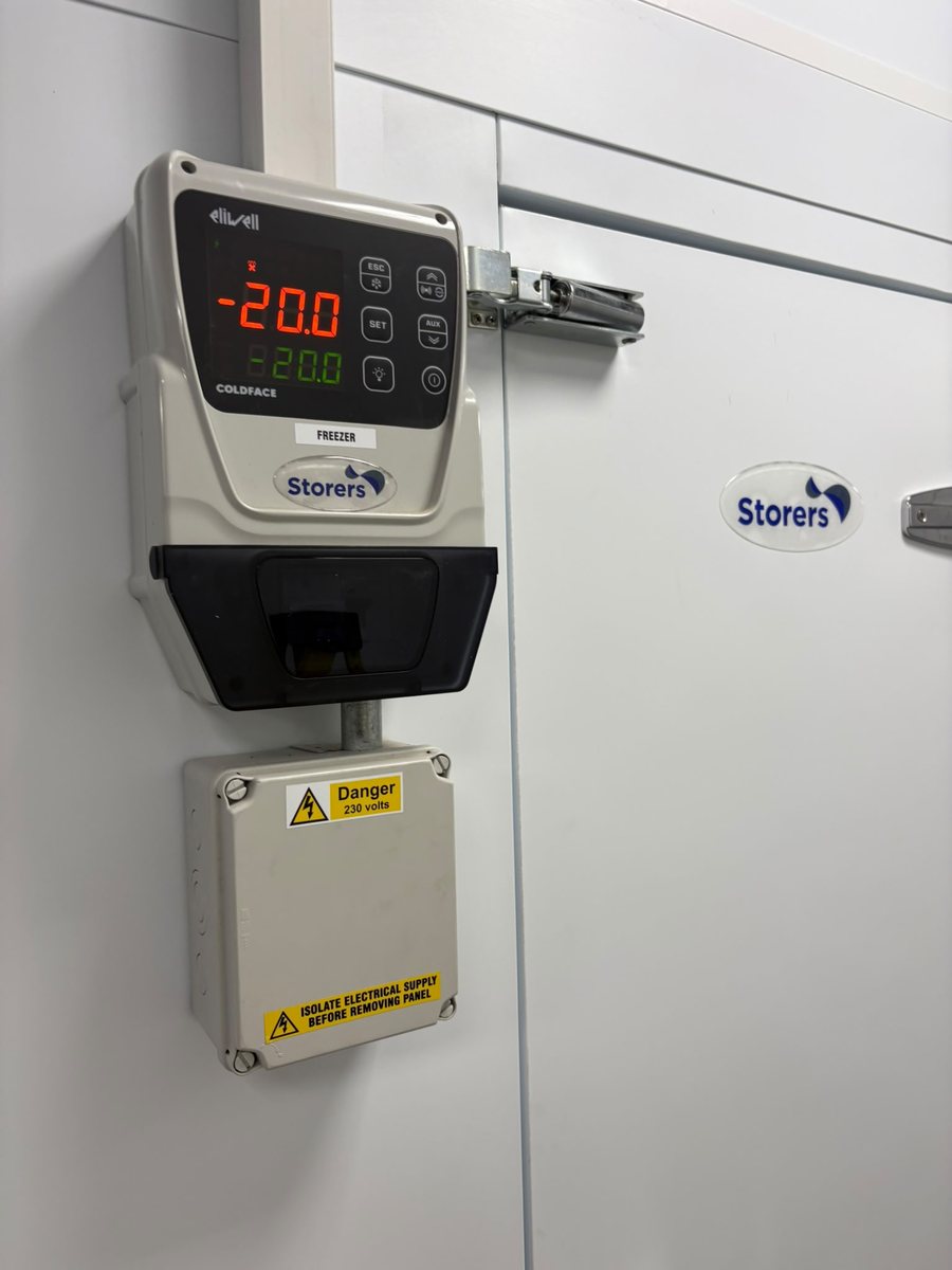Eliwell Coldface freezer control panel and isolator showing minus twenty degrees on a Storers cold room door
