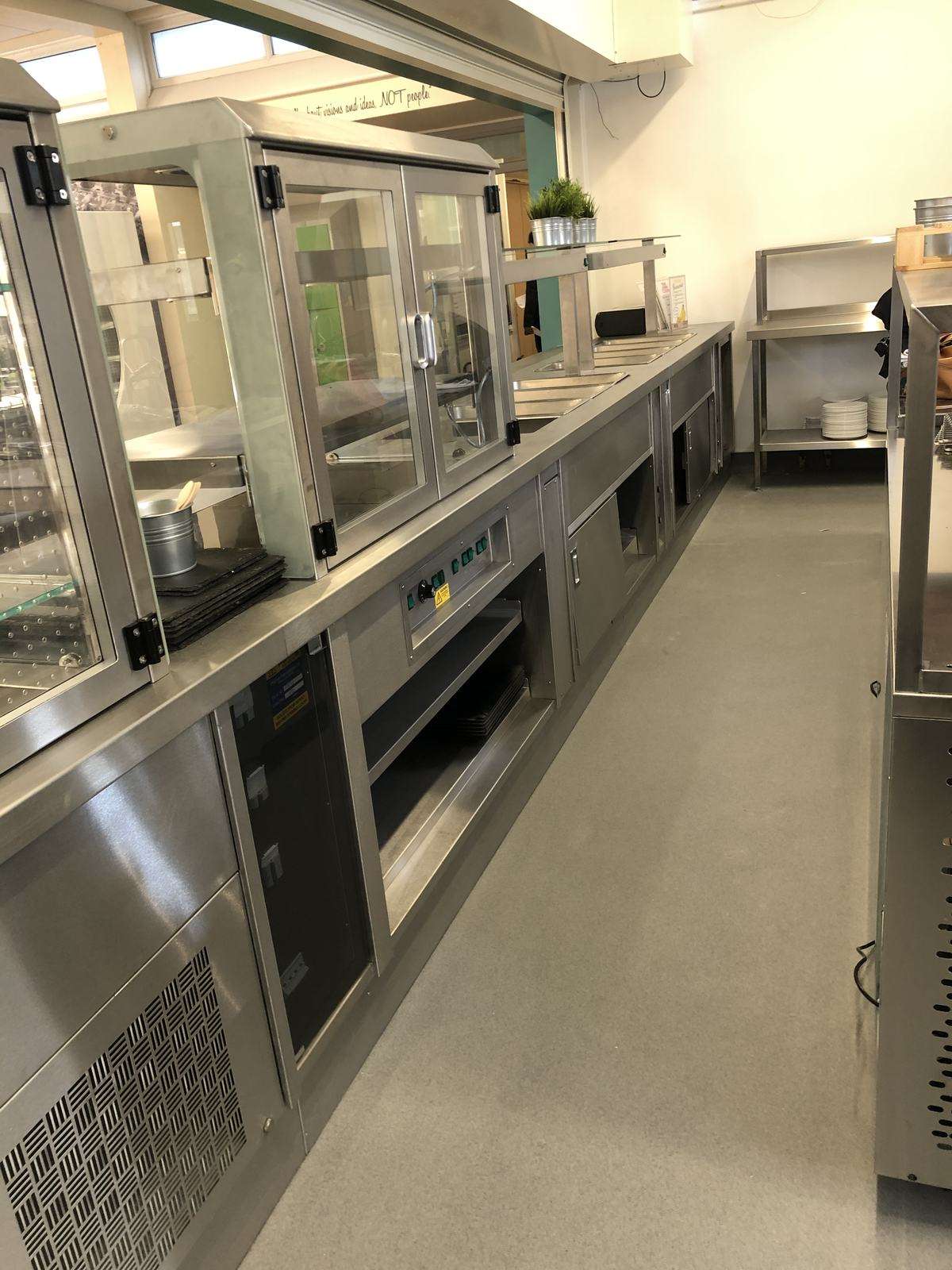Waltons Academy Grantham — new kitchen installation showing central cooking suite and extraction canopy